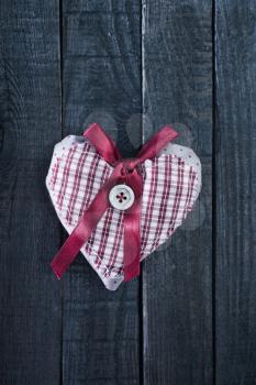 red heart on wooden background, festive background