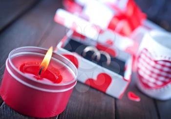 present for valentines day in the box and candle on a table