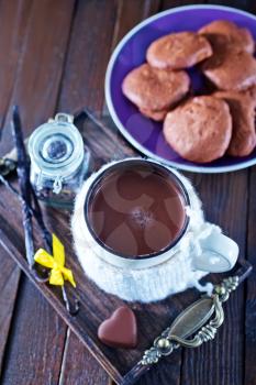 cocoa drink in cup and sweet cookies