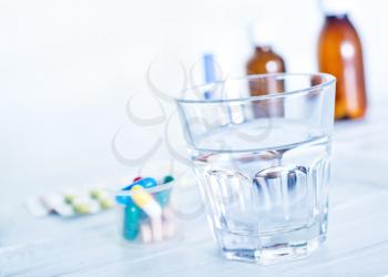 medical pills and water on the table