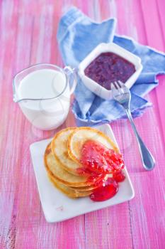 pancakes with raspberry jam on the plate