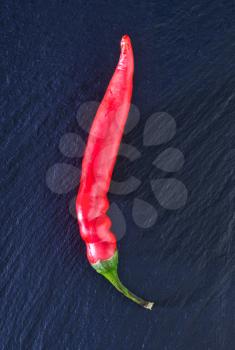 red hot chilli peppers on the black table