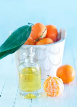 Tangerine essential oil on the white table