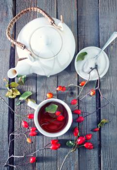 fresh tea with rosehip on a table