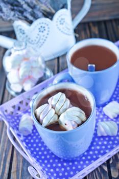 cocoa drink with marshmallows on a table