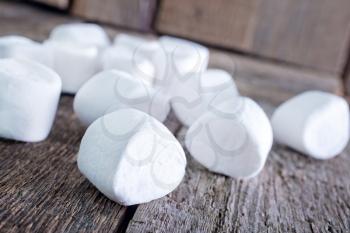 white marshmallows  on the wooden table, fresh and sweet marshmallows