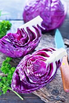 blue cabbage on board and on a table