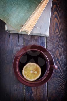 tea with lemon in cup and on a table