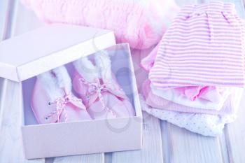 baby clothes for baby girl on a table