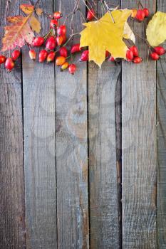 autumn background, dry leaves on wooden table