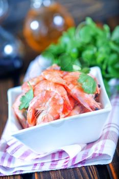 shrimps in bowl and on a table
