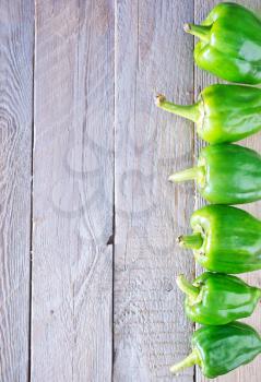 green pepper on the wooden table, vegetables