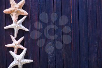 starfish on wooden background, sea shell on a table