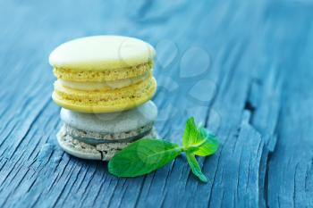 lemon macaroons and mint leaf on a table