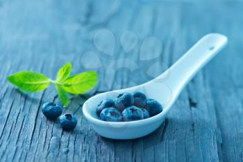 fresh blueberry on the wooden board, berries on a table