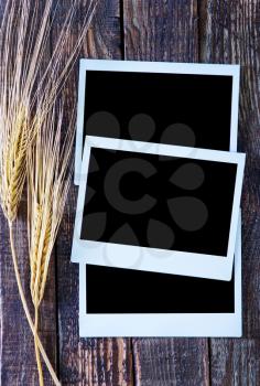 wheat and photo on the wooden table