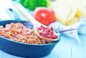 minced meat with tomato sauce in the pan