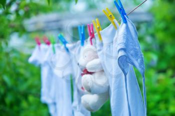 baby Clothes hanging on line in garden