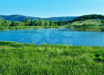 lake and green grass, summer landscape, nature in Crimea