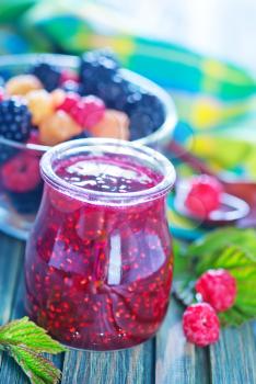 jam from berries and fresh berries on a table