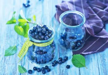 fresh blueberry in glass and on a table