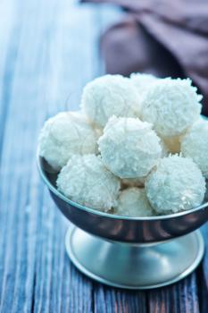 sweet coconut balls on the wooden table