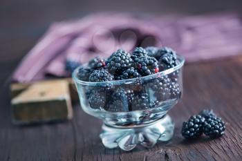 black berries in bowl on a table