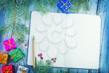 notepad and christmas decoration on a table