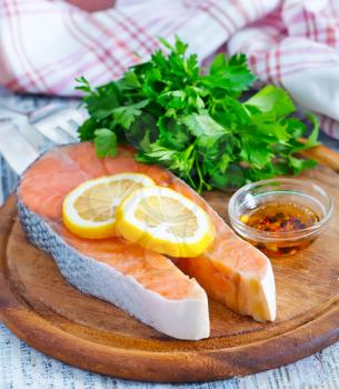 fresh salmon and lemon on the wooden board