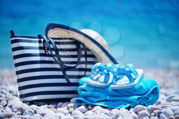 bag and hat on the beach, summer background