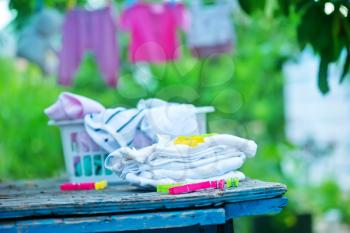 baby clothes in garden, clear baby clothes