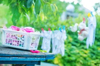 baby clothes in garden, clear baby clothes