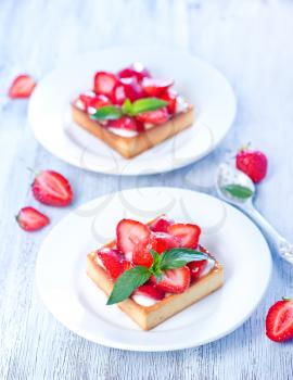fresh cake with fresh strawberry on a table