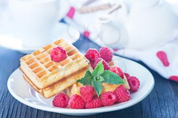 belgium wafer with fresh raspberry on the plate