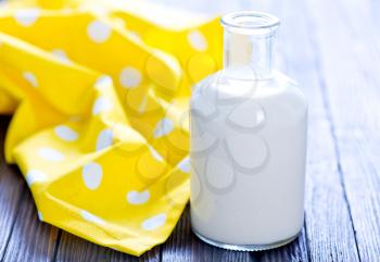 fresh milk in bottle and on a table