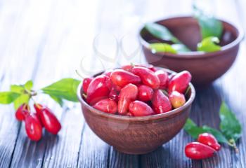 red berries of cornus on a table