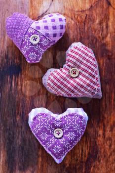 Love hearts on vintage wood, violet hearts