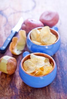potato chips in bowls and on a table