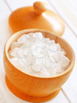 White sugar in the wooden vase