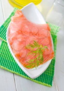 Fresh salmon in the white bowl