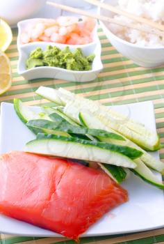 ingredients for sushi, sakmon and cucumber