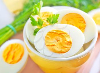 boiled eggs in bowl and on a table