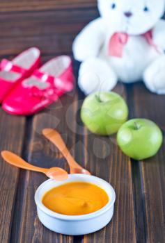 baby food in bowl and on a table