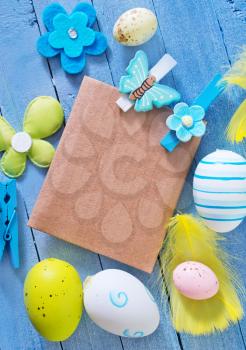 easter background, easter eggs on blue table