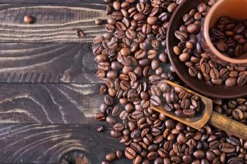 coffee beans on the wooden table, roast coffee beans