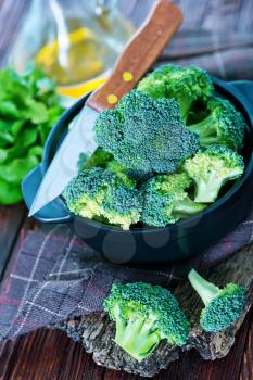 broccoli in bowl and on a table