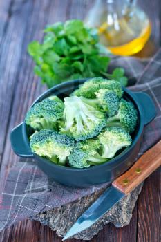 broccoli in bowl and on a table