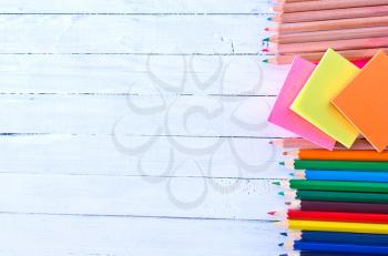 school supplies on a table, color pencils
