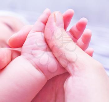 baby hand in mother hand, newborn hand