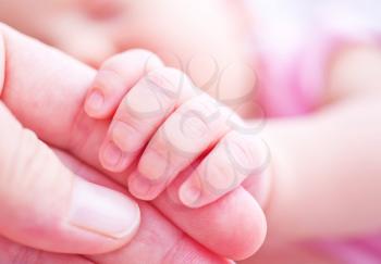 baby hand in mother hand, newborn hand